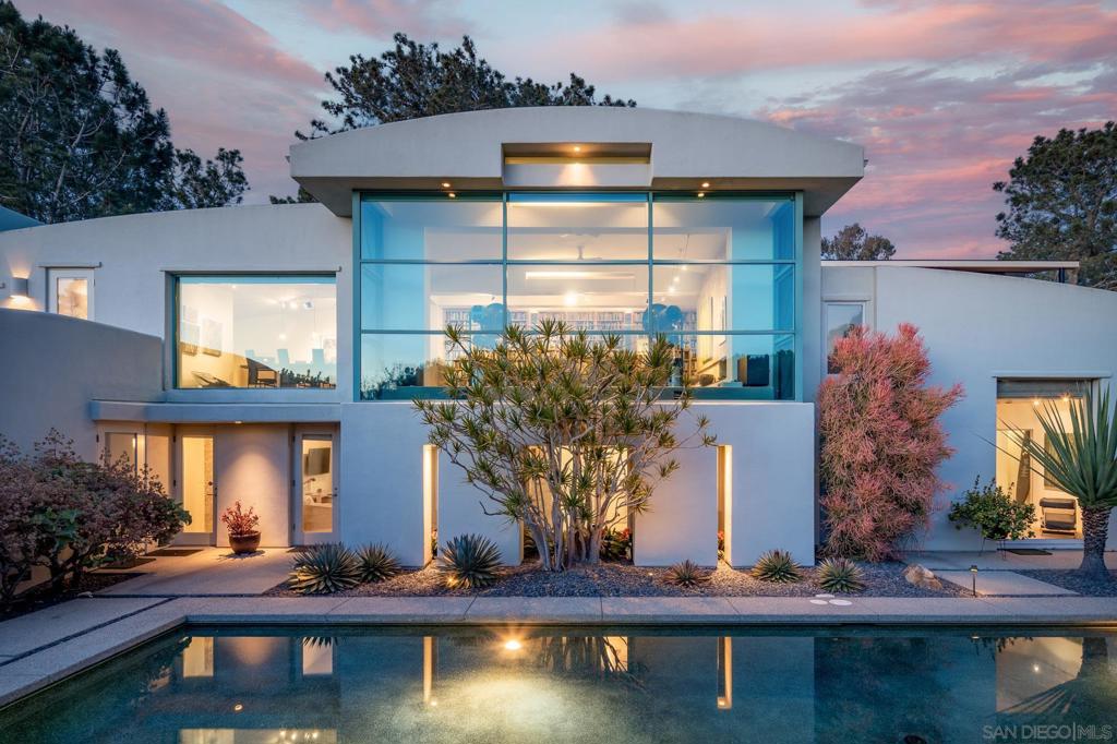 Designed by the iconic designer/architect, Ken Ronchetti, this architectural gem is flooded with natural light from the floor to ceiling windows. Over 3,900SF of living space, 3BR+/3.5BA, gorgeous ocean views over tree tops & a zen-like backyard with an oversized sun deck, large lap pool & plenty of space to spread out on this 17,640SF lot. Steps away from Del Mar Village shops, restaurants & the beach. Designed by the iconic Designer/Architect, Ken Ronchetti, this architectural gem is flooded with light from the floor to ceiling windows & offers gorgeous ocean views. Easily accessible yet private in the beautiful hills of Olde Del Mar. With a reverse floor plan, all 3 bedrooms (plus a den or extra 4th bedroom) are located on the first floor while the entertaining spaces are upstairs. Enjoy al fresco dining out on the large ocean view sundeck, swim in the large lap pool or just relax in the zen-like manicured backyard. There is plenty of room to spread out on the 17,640SF lot. Coastal living at its finest with sounds of the surf & walkability to the best of Del Mar’s restaurants, shops or the beach.