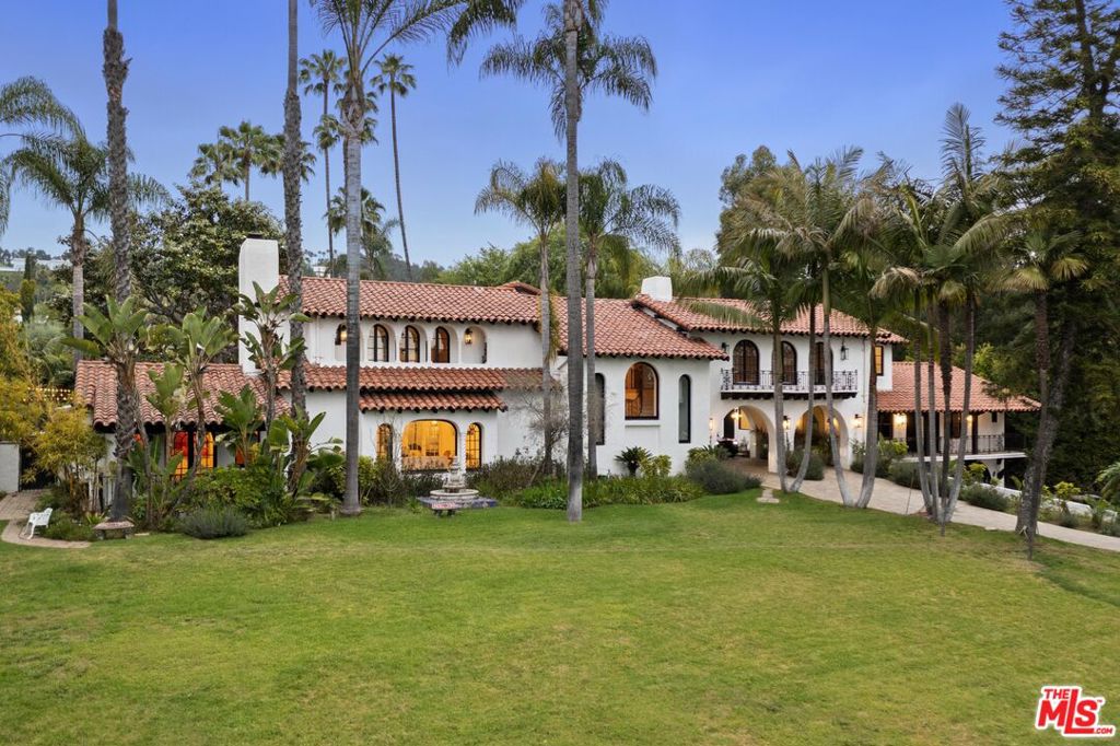 Welcome to the Palmery- a Luxurious Lifestyle- on Sunset Blvd in Beverly Hills. This grand Contemporary Mediterranean estate boasts eight exquisite bedrooms and thirteen lavish bathrooms, set amidst a verdant landscape with over four hundred diverse tree and flower species and more than one hundred majestic palm trees. Enter through a private gateway and be greeted by expansive park-like grounds that frame the front yard, setting the stage for the grandeur within. The villa is a masterpiece of design, featuring high ceilings, expansive windows that flood the interior with natural light, and a stunning entryway with a fountain that epitomizes elegance. Every bedroom is en suite, ensuring ultimate privacy and comfort, with the master suite offering two walk-in closets, a spacious lounge area, luxurious lounge movie theatre, providing an exceptional cinematic experience in the comfort of your own home and breathtaking views of the estate's backyard. The master suite's two bathrooms include a steam shower and a large oval luxury tub, creating a spa-like retreat. Detailed moldings adorn the living room and dining room, providing the perfect setting for formal gatherings, while a private patio stems off from the lounge area offering serene views of the lush front yard. Outdoors, a cascading waterfall flows into a pristine oasis, complete with a vast pool, relaxing playa, and a jacuzzi. The area is complemented by a professionally built-in bar, a ten-seater circular sunken fire pit, a brand new barbecue station, and a pickleball or padel street court for ultimate recreation. Additionally, an outdoor cascade creates the perfect ambiance for meditation and yoga. A side driveway for discreet employee and service entry. This estate is a rare opportunity for those who seek to live in a grandeur and an unmatched lifestyle.