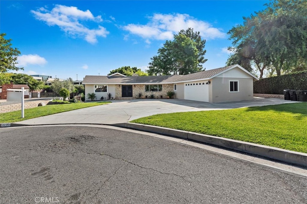 Stunning "Entertainer's Delight" has 5000sf of newly remodeled living space. Welcome to this exceptional luxury estate, where high-end design meets everyday comfort in one of the area’s most prestigious neighborhoods. Completely remodeled, this home offers a seamless blend of modern sophistication and timeless architectural charm. As you step inside, you're welcomed by soaring ceilings, an open-concept layout, and elegant travertine flooring that flows throughout the home—offering both beauty and durability. A standout design feature, the gorgeous, exposed wood ceiling beams, adds warmth and character to the expansive living spaces. At the heart of the home is a designer chef’s kitchen, thoughtfully outfitted with top-of-the-line appliances, a double oven, sleek quartz countertops, custom cabinetry, and a spacious island perfect for both casual dining and entertaining. The primary suite is a private sanctuary, offering his-and-her walk-in closets and a luxurious spa-inspired ensuite bath with dual vanities, a freestanding soaking tub, and a large walk-in shower with dual shower heads for a truly indulgent experience. Step outside to a beautifully landscaped backyard—an ideal space for relaxing or entertaining. With ample room to add a pool, outdoor kitchen, or guest casita, the possibilities are endless to create your dream outdoor oasis. Located just minutes from fine dining, boutique shopping, top-rated schools, and major commuter routes, this home offers refined living, modern comfort, and effortless elegance. Schedule your private showing today and experience this extraordinary property for yourself.