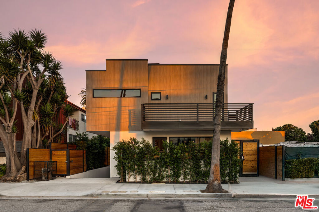 Experience the pinnacle of luxurious living in this rare beachside offering. Spanning 2,000 sq. ft. this brand-new residence is just seconds to the beach. With only three units in this exclusive enclave, you will find a rare combination of privacy and modern elegance. Inside, discover expansive light-filled spaces with sleek, contemporary finishes. The gourmet Chef's kitchen is thoughtfully designed for both function and entertaining, seamlessly connecting to the open living area. Relax on the multiple outdoor terraces, perfect for lounging in the sun and enjoying the ocean breeze. Retreat to two generously sized bedrooms, each accompanied by a designer-appointed ensuite bathroom. The expansive private rooftop deck, engineered to support a spa, offers a show-stopping space for relaxation and gatherings under the stars. Additional features include two secure parking spaces with the option to purchase a third, a rooftop wetbar and side by side washer and dryer. All of this is just steps from the sand and Main Street's acclaimed restaurants, charming cafes, and boutique shopping. Some of the photos have been virtually staged/enhanced.