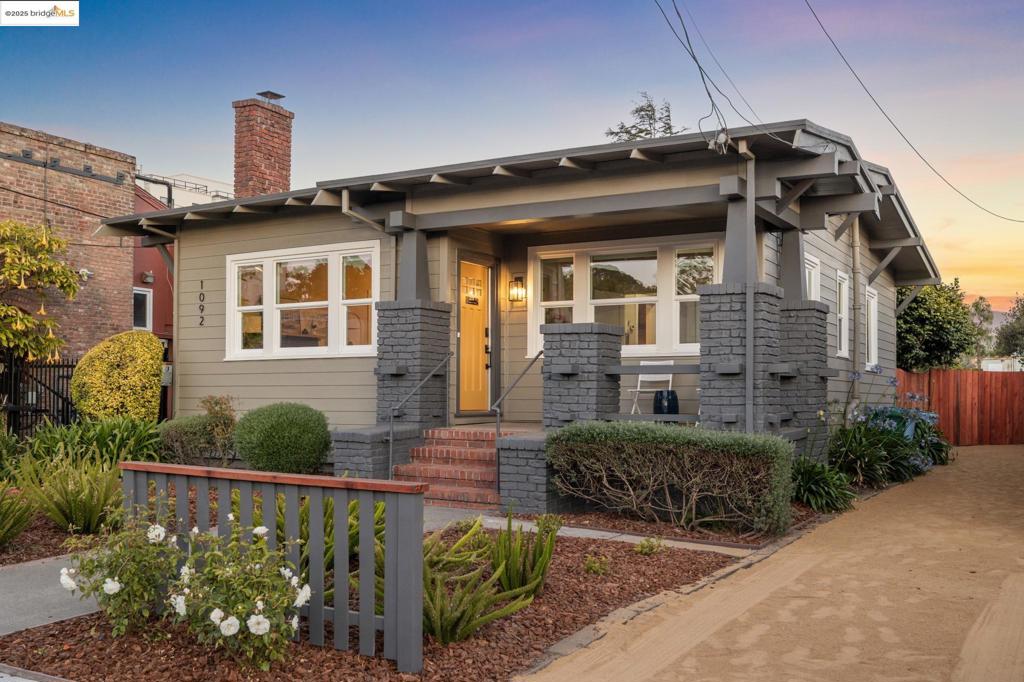 Berkeley Bungalow w/ Modern Flow, Steps from Caffe Chiave Picket fence says “modern Craftsman-style,” - Layout & upgrades say “contemporary EastBay living.” Located in highly walkable W. Berkeley, this 2-bedroom, 2-bath single-family bungalow combines timeless character w/ thoughtful updatesdesigned for today’s lifestyle. Remodeled inside & out, the home invites you up a landscaped path to brick porch. Open-concept living, dining, & kitchenarea flows seamlessly to private, low-maintenance yard w/ flexible sitting area for relaxing or secure parking pad. Office nook for additional work spaceoff kitchen. Remodeled kitchen features SS appliances, gas range, dishwasher, breakfast bar & stacked washer/dryer. 2 well-sized bedrooms includetrue primary suite w/ generous closet & updated en-suite bath w/ walk-in shower. 2nd full guest bath w/ modern finishes & floating shelves. Interiordetails w/ engineered wood flooring throughout, dual-pane windows w/ coverings, trayed ceilings, & stylish designer lighting. Long shared drivewayleads to private parking pad behind wide gate for vehiclular access. Walk & Bike Score of 93. Steps from neighborhood faves like Caffe Chiave & LaoGarden. 10-minute bike ride to Ashby BART or UC Berkeley. Not to miss! Open Sun.