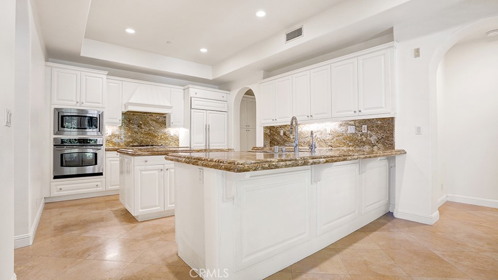 Welcome to 9 Altino, an elegant 3-bedroom, 3.5-bath residence nestled within the exclusive gated enclave of Ziani in Newport Coast. This expansive home boasts the community’s largest floor plan, offering a sophisticated blend of volume and natural light, complemented by soaring ceilings and a bright layout.
The main level is designed for both refined entertaining and everyday ease, featuring a formal living room with fireplace, a gourmet granite kitchen outfitted with stainless steel appliances and built in Sub Zero and Viking refrigeration. The spacious first floor primary suite offers a serene retreat with a luxurious soaking tub, dual vanities, and a generous walk-in closet.
The second floor loft space creates the ideal work-from-home setup with plenty of natural light, built in desk and sitting area. The upstairs guest bedrooms are spacious and private, one with an en suite bathroom, the other with a private terrace overlooking the community.
Additional amenities include an interior laundry room and a two-car direct-access garage and ample built in storage. This home has two spacious patio areas which are great for entertaining, one off of the kitchen and the other on the side of the home looking out over the community. Residents of Ziani enjoy resort-style living with access to a clubhouse, saltwater pool, spa, and communal BBQ area—all within minutes of scenic hiking trails, pristine beaches, world-class shopping and dining, and the iconic Pelican Hill Resort.