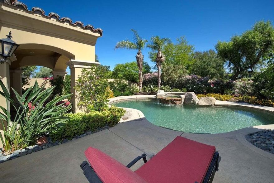 This beautiful home inside Toscana Country Club offers spacious desert living on a generous corner lot. New, mature landscaping provides ultimate privacy while still allowing for spectacular views of the mountains and Hole 4's Green of the Jack Nicklaus Signature North Golf Course. Upgrades to this home include fresh interior and exterior paint, newer HVAC, new pool equipment, and updated furniture. Inside, the two sets of sliding glass doors blend indoor-outdoor living areas, while the wetbar provides butted-glass windows allowing for panoramic views. The gourmet kitchen offers the perfect entertainment prep space, complete with ample cabinetry, island, breakfast bar peninsula, granite counterops, and SubZero Wolf stainless steel appliances. For casual dining, a breakfast nook is accompanied by a dry bar perfect for morning coffee. Retreat to the master bedroom,which features space to lounge, and sliding glass doors to a private patio overlooking the pool and spa. The grand en-suite has His & Hers sinks with separate vanity, enormous soaking tub, walk-in shower, and His & Hers closet entries. Guests can relax in the main-home guest room, or a more secluded guest room with access to a private patio in the courtyard.