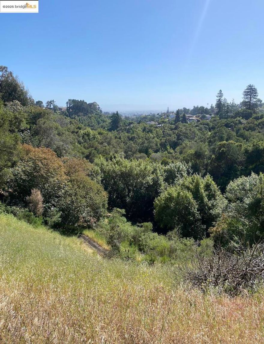 Amazing opportunity to build a dream home with a view of the bay or develop land into 4 lots. Or use your imagination! Lot is across from the Sequoyah Country Club, 3.31 acres of undeveloped land in the Oakland Hills. Zoned RH-3. Architectural renderings included. The lot is best accessible just north of 4133 Oak Hill Rd. Land is on a downward slope and stretches down the valley. Buyers to investigate with City of Oakland on building restrictions, planning, and utilities.