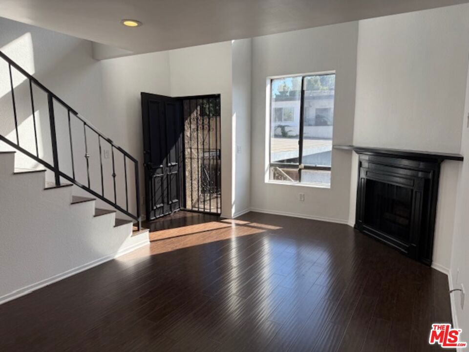 Beautiful light and bright townhome style condo situated in the heart of all that is Up and Coming, and all that already is, in Inglewood!!! Wonderfully updated with stunning hardwood flooring throughout, custom paint, warm and inviting fireplace with a beautiful mantel to decorate for all your special occasions. New custom window coverings, and an amazing spacious loft style bedroom. Large private patio off the kitchen to continue the fantastic entertaining flow the home so generously offers. full size Washer and dryer in unit and 2 secured wide side by side parking spaces. A wonderfully well maintained small complex with a fantastic neighborhood to grow with! Welcome Home!!!