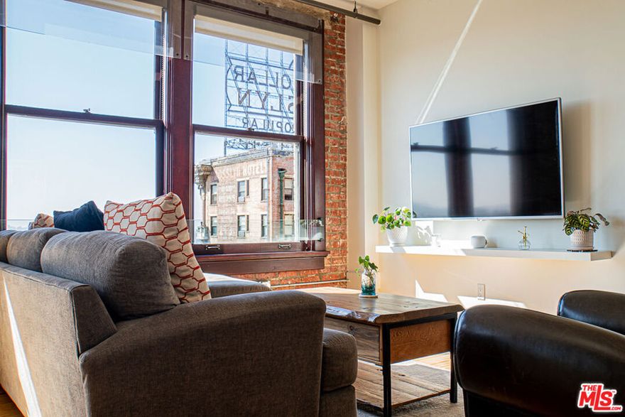 Gorgeous Updated Loft with Panoramic City Views! This is an incredible opportunity to lease a contemporary loft in The Rowan Building, the crown jewel of Downtown LA's Historic Core. Unit 1102 is a spacious 1 bed / 1 bath condo with an open, modern loft layout. The interior tastefully blends historic character with modern finishes and comforts, including hardwood floors, soaring ceilings, custom Scavolini cabinetry, updated countertop and backsplash, high-end stainless appliances, in-unit W/D, and central heat and AC with smart thermostat. The enormous full bath features stone tile, granite counters, and an extra-deep soaking tub. A wall of huge, mahogany-framed windows brings in an abundance of natural light to the unit and opens to an expansive view that stretches from DTLA all the way to the mountains! Originally built in 1912, the historic Rowan Building was designed by famed LA architects Parkinson & Bergstrom in the iconic Beaux-Arts style. In 2009, the building was extensively restored and converted into live-work condominiums. Historic details have been preserved including exposed brick walls, Carrara marble corridors, and Art Deco elevator doors. The property boasts countless amenities including 24/7 security and concierge, bike storage, and a resident lounge. Perfectly-manicured outdoor spaces include a lush tropical garden, pet relief area, hot and cold plunge pools, outdoor seating with fire pits, and built-in gas BBQs. The Rowan is perfectly situated within the vibrant Historic Core neighborhood: adjacent to Spring Street Park, two blocks from the Pershing Square Metro, and surrounded by the countless restaurants, culture, transportation and nightlife options to compliment the perfect downtown lifestyle. This is the DTLA lease opportunity that you have been looking for! Showing by appointment. Tenant pays Electric and Cable/Internet. Parking and storage available for an additional fee.