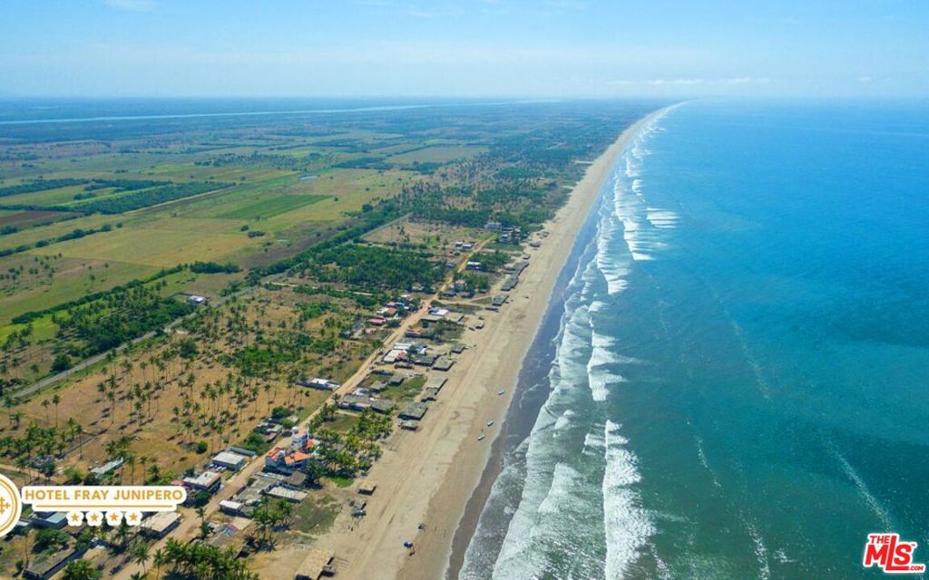 Discover your slice of paradise on Isla Playa de Novillero, Mexico's hidden gem boasting one of the longest and safest beaches globally. Nestled within this idyllic setting lies a generous parcel of 230 hectares/568 acres of prime beachfront land, complete with water and electricity services. This extraordinary property offers limitless possibilities for a luxurious hotel, resort development, or a high-end residential community. It is also ideal for any investor or buyer capable of significant investments.Strategically located just five miles from the vibrant cities of Tecuala and Teacapan, and a mere 80 miles from Mazatlan International Airport, Novillero Beach beckons with its pristine white sands, inviting waters, and tranquil ambiance. Dive into the crystal-clear Pacific waters, where the beach stretches for approximately 56 miles, providing nearly half a kilometer of breathtaking coastline. Not to mention, the enchanting riverfront estuary spanning 320 meters adds an extra layer of natural allure.Nature enthusiasts will delight in the proximity to captivating landmarks like the Cuautla Canal and Brava Lake, teeming with tropical mangroves and a diverse array of avian residents. With its unrivaled beauty and ecological diversity, Playa de Novillero presents an unparalleled opportunity for a world-class ecological resort or a stunning luxury residential development. Excitement builds with the imminent completion of the Playa Espiritu development project, including the construction of an international airport in Teacapan, slated for 2025. Positioned to rival esteemed resort destinations like Cancun and Los Cabos, Playa de Novillero is poised to emerge as Mexico's next premier tourist hotspot.Calling all visionary developers: seize this extraordinary business opportunity. With a pristine ownership record spanning over 36 years, rest assured that all legal documentation pertaining to the property is clear of any encumbrances. Surveying, certification of location, and demarcation have been meticulously completed and registered with local authorities, ensuring a seamless transaction process.Don't miss your chance to sculpt your dream venture amidst the breathtaking vistas of Playa de Novillero. Embrace the allure of coastal living and embark on an unparalleled journey of prosperity and innovation. Paradise awaits, make it yours today.