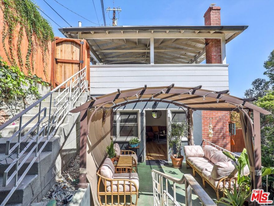 Serene Hillside Hideaway with Stunning Views.  Fully Furnished. Welcome to 6921 Paseo del Serra, a peaceful retreat tucked into the hills of Hollywood. This beautifully furnished unit (approx. 868 sq ft) offers the perfect blend of seclusion and convenience just minutes from the heart of the Hollywood, yet surrounded by nature and quiet. Step inside to a bright and cozy living room filled with natural light and inviting furnishings. The modern kitchen features a butcher block island and everything you need to cook and entertain in style. The serene bedroom includes a plush bed, while the sleek bathroom offers a spacious shower and contemporary finishes. A dedicated office space makes working from home easy and comfortable. Outdoor living shines here, with multiple private spaces to enjoy: a sunny deck with a grill, a covered patio with wicker furniture, and a lush garden area with a staircase leading to a tranquil, private terrace.Enjoy a strong sense of community and included parking (one space, with a second available for an additional fee). This unique hillside gem offers the ultimate in comfort, style, and serenity. Don't miss your chance to call it home.