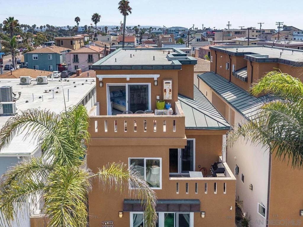 Just steps from the shoreline, this exceptional three-bedroom, two-story beach condo offers the ultimate blend of elevated coastal living and proven investment performance in the heart of Mission Beach. Beautifully maintained and thoughtfully updated, the home features multiple levels of sunlit living space, a rare two-car garage, and outdoor spaces designed for relaxation and entertaining. A spacious second-level balcony is ideal for barbecuing and hosting guests, while the private rooftop terrace delivers panoramic views of Mission Bay and the Pacific—perfect for sunset cocktails or morning coffee above the coast. With a strong, successful history as a short-term rental, this property doubles as both a luxurious beachside retreat and a lucrative income opportunity. Located just blocks from Belmont Park and close to all the dining, shopping, and recreation Mission Beach has to offer, 735 Jersey Court captures the essence of Southern California seaside living