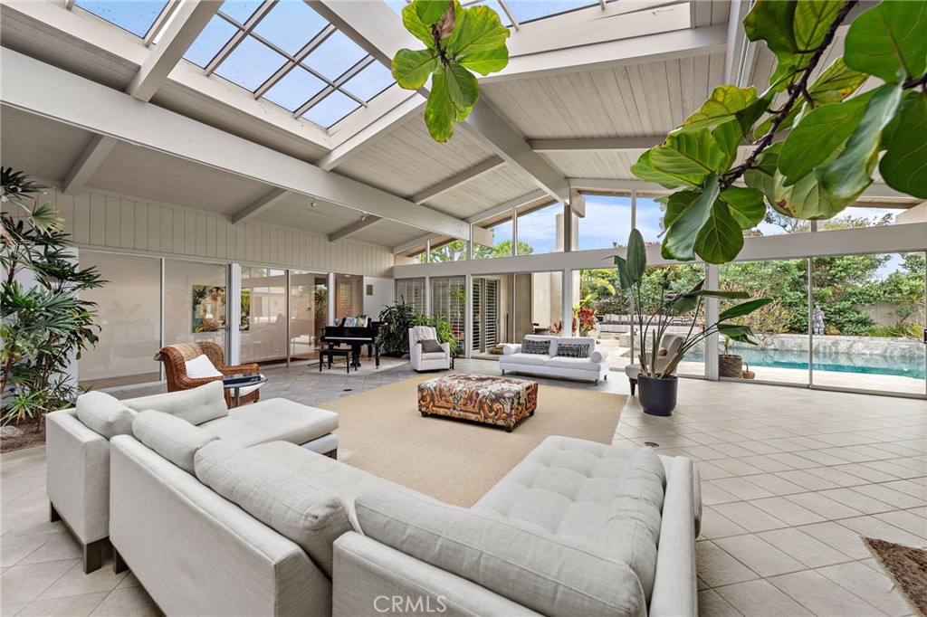 Experience the essence of mid-century modern living in this legendary Dover Shores residence. Set on a generous 15,000+ sq ft lot, this corner lot home boasts 4 spacious bedrooms and 5 bathrooms. Dive into endless Newport Beach summer days by your private pool—a true California dream. Single story living all surrounding an incredible atrium style main living area, canopied under stunning architecture. This home is not just a place; it’s a lifestyle. Discover the art of elevated living at 1401 Lincoln Lane, one of the best, most highly sought after and private/quiet streets in Dover Shores, where every corner of this remarkable home tells a beautiful story.
This is a FURNISHED SEASONAL RENTAL - Lease is for short-term increments depending on availability. Rates vary and range per month & season! For inquiries about availability and leasing term options please contact Jaime Weber or Jen McDonald.