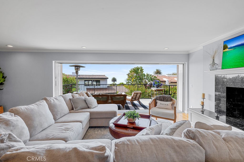 Discover the charm and lifestyle of Malaga Cove in this beautifully crafted coastal home, perfectly situated in the heart of Palos Verdes Estates. Thoughtfully designed to capture the essence of Southern California’s indoor-outdoor living, this residence boasts captivating views and expanded living spaces—ideal for entertaining, or quiet relaxation.
Begin your tour on the main level by entering an elegant private courtyard. This leads to the dining area that connects seamlessly to a beautifully updated kitchen featuring granite countertops, crisp white cabinetry, premium stainless-steel appliances, and a chef-caliber 6-burner stove. Just beyond, the light-filled living room serves as the heart of the home—warm and welcoming with hardwood floors, a cozy fireplace, and dramatic floor-to-ceiling pocket glass door that reveals a partial ocean view and opens onto a picturesque deck. The main level also features a tranquil primary suite with a private bath, alongside a second bedroom and a hallway bathroom with dual sinks.
Downstairs, the lower level expands your options with a third bedroom, an additional bathroom, a laundry room, and a versatile den with its own fireplace and patio—perfect for guests, a home office, media room, or personal gym.
Additional highlights include:
• 3-zone A/C system (2 condensers)
• Updated windows and doors
• EV charger in the attached two-car garage
Located just minutes from Malaga Cove Plaza, scenic trails, renowned schools, and pristine local beaches, this home embodies the best of Palos Verdes Estates living—elegant, effortless, and ready to enjoy. Truly a rare opportunity.