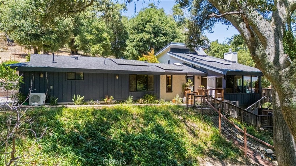 Tucked away on 2 private acres in one of Atascadero’s most sought-after west side locations, Las Encinas, this beautiful property offers the perfect blend of sustainability, comfort, and versatility. With owned solar and a Tesla battery backup, you'll enjoy zero electric bills while living with modern peace of mind. The main home features central air plus efficient mini-splits through out, ensuring year-round comfort. A new roof and completely upgraded septic system with new leach lines mean the big-ticket items are already taken care of. A standout feature of this property is the income-producing junior ADU—ideal as a rental, guest suite, or a luxurious second primary bedroom. It even includes its own private hot tub, creating the ultimate retreat or rental experience. There’s ample space to build an additional unit, expand, or simply enjoy the room to breathe in total privacy. Whether you’re looking for a smart investment, multi-generational living, or a quiet getaway close to town, this west side gem checks all the boxes.