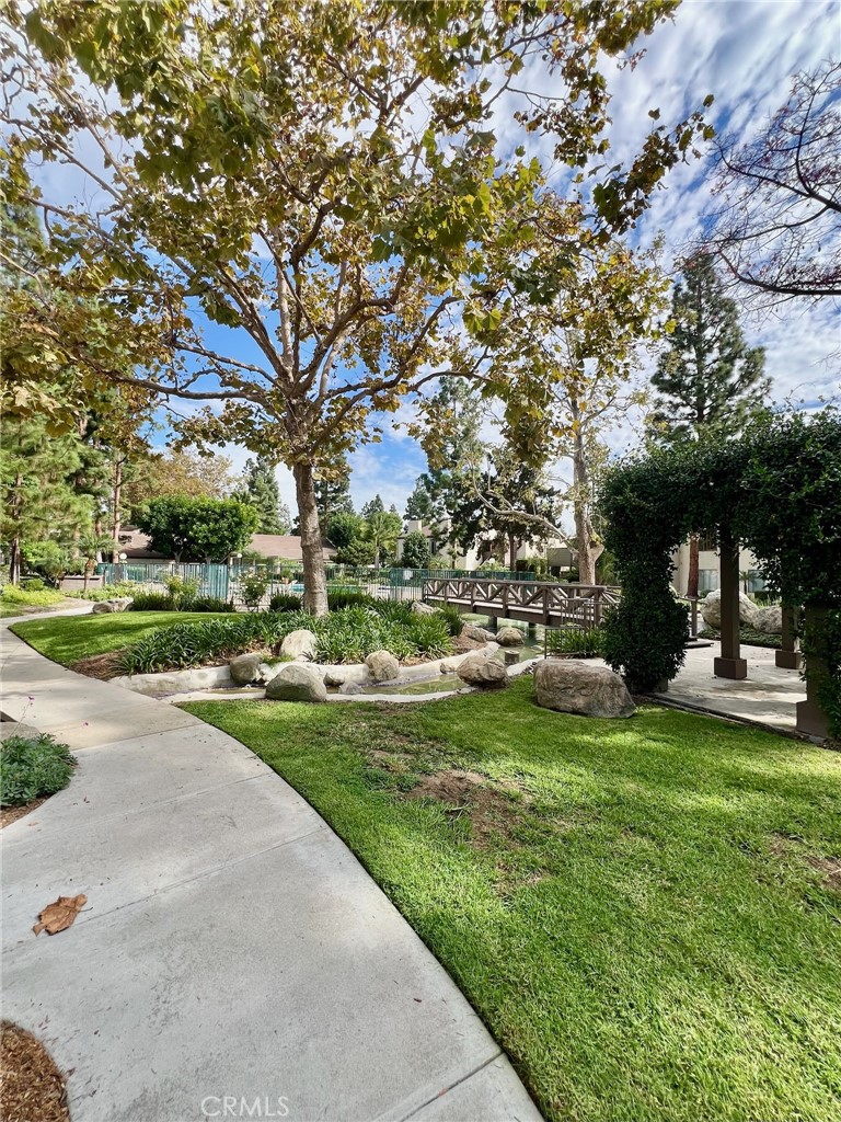 Welcome to your peaceful retreat in the heart of Santa Ana! This bright and inviting 1 bedroom, 1 bath condo is nestled within the beautifully maintained Cabrillo Park community - known for its winding walkways, mature trees, and a tranquil creek that flows throughout the property.
Enjoy the open living space that leads to two private balconies - perfect for morning coffee, outdoor dining, or simply soaking in the park-like views. The serene surroundings make this home feel like a getaway while keeping you close to everything you need. Inside you'll find a spacious living room with new carpet and decorative chair rail trim. The kitchen is galley style with a pantry, plenty of cabinet space, free-standing range, dishwasher and a refrigerator. The dining area is situated between the kitchen and rear patio - choose to dine with the afternoon breeze or alfresco. The bedroom is tucked away on the opposite side of the unit with mirrored closet doors and a hallway that leads to the full bath with a tub/shower combo, tiled vanity with plenty of storage and a privacy glass window that allows natural light to flow through.
Community amenities include a sparkling pool and spa, fitness center, clubhouse, and multiple laundry rooms for added convenience.
Centrally located near shopping, dining, and freeway access, this condo offers a peaceful upscale lifestyle with everyday practicality.