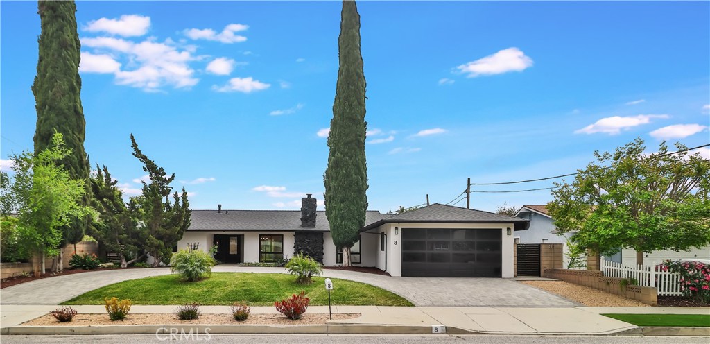 Welcome to this stunning, remodeled home located in the highly sought-after West Thousand Oaks area. Renovated just three years ago, this residence boasts a designer kitchen and luxurious bathrooms, offering modern elegance and comfort. The open floor plan is thoughtfully designed to maximize natural light, creating a warm and inviting atmosphere throughout. Beautiful wood flooring adds a touch of sophistication, while the cozy central fireplace serves as the perfect focal point for relaxing evenings or entertaining guests.
Step outside to a generous backyard, ideal for outdoor dining, play, or simply relaxing in your private oasis. The home features two full primary suites, making it an excellent choice for multi-generational living. Each primary suite offers ample space, privacy, and comfort, providing a versatile layout that caters to your lifestyle needs.
This property combines modern upgrades with a desirable neighborhood setting. Whether you're hosting gatherings, enjoying quiet evenings by the fire, or taking advantage of the spacious outdoor area, this home offers the perfect blend of style, functionality, and convenience. Don’t miss your chance to own this exceptional property!
