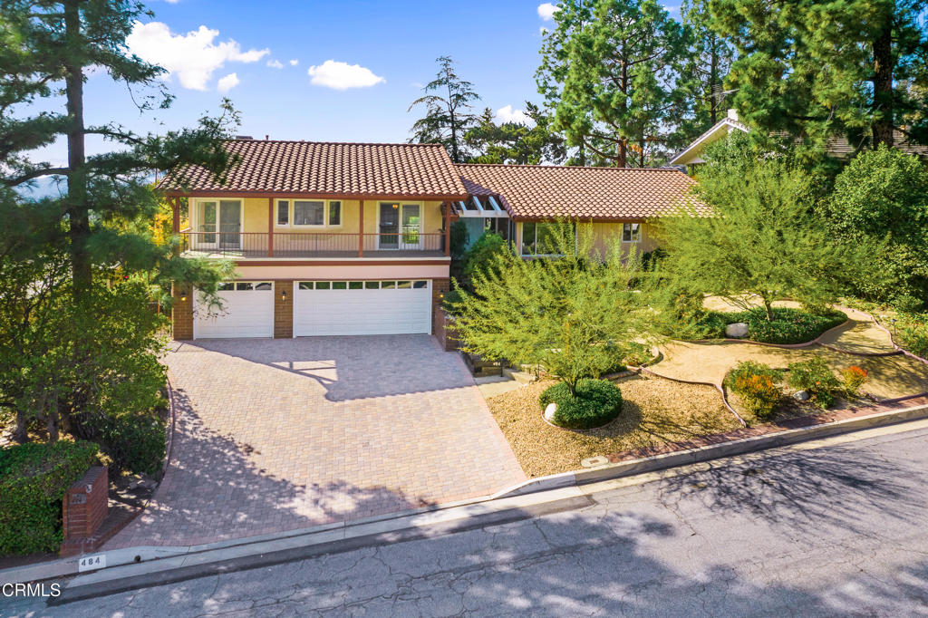 Views, Views, Views! Welcome to this spectacular La Canada traditional, where a versatile split-level floor plan offers a seamless blend of comfort, space, and natural beauty. Step through the double-door entry into an expansive living room with soaring wood-beamed ceilings, a gas-burning fireplace, and two sets of sliding glass doors that open to the backyard framing serene vistas and flooding the space with light. The adjacent dining room flows into a bright kitchen with generous cabinetry, double ovens, a dishwasher, and laminate flooring. A cozy breakfast area connects to a spacious balcony patio, offering an ideal spot to enjoy panoramic views of the San Gabriel Mountains. The private primary suite is a true retreat, featuring vaulted ceilings, a private balcony with stunning views, multiple closets, and an en-suite bath with dual vanities, mirrored closet doors, and a glass-enclosed shower. On the lower level, the family room invites you to relax with its built-in shelving, fireplace, and backyard access framed by beautiful scenery. This space also includes a convenient office nook and a three-quarter bath with exterior access to the pool. The west wing of the home features three additional bedrooms and a shared full bathroom. Additional highlights include: 3-car garage with direct home access, dual-paned windows, central A/C and heating, window treatments, laundry area in garage, attic with pull-down ladder. The landscaped grounds provide a picture-perfect backdrop with automatic sprinklers, a grassy play area, covered patio with BBQ area, and a sparkling pool and spa, all positioned to take full advantage of the sweeping mountain, city, and golf course views, including DTLA, Pasadena, and the La Canada Flintridge Country Club. Located within the award-winning La Canada Unified School District and just moments from LCF Country Club, this home is a rare opportunity to enjoy spectacular views from every corner.Tenant occupied...please do not disturb occupants.