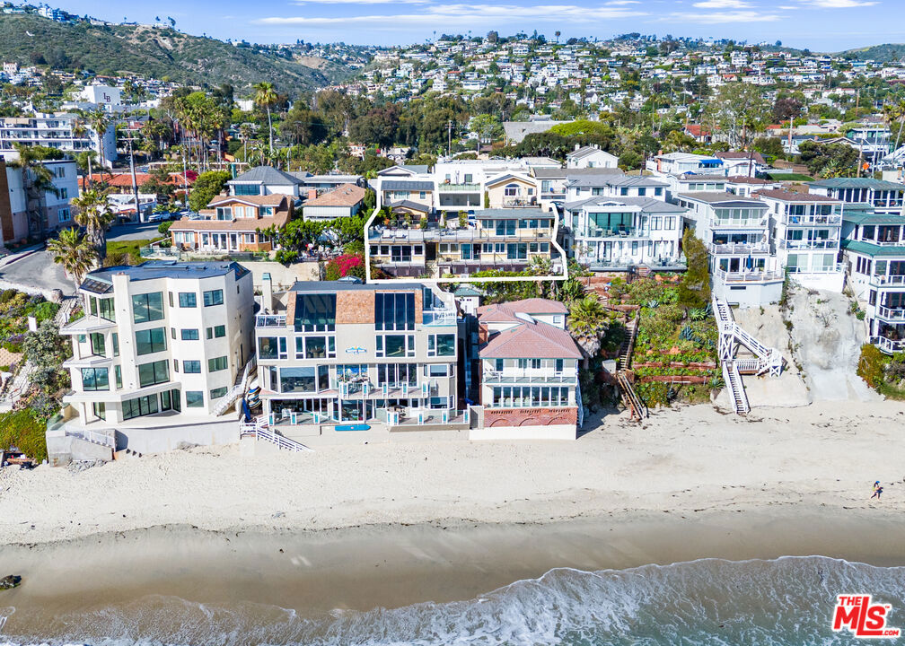 SHORT-TERM RENTAL PROPERTY. Located one building from the sand, The Retreat in Laguna features (8) luxury villas each with its own short-term rental permit. The unit mix includes (1) fourplex, (1) duplex, and (2) single-family homes with expansive ocean views in 7 of the 8 units. The property has undergone both interior and exterior renovations with all (8) units updated. Community features include outdoor shower, beach walkway access, on-site security system, community laundry room, paver driveway and walkway and (9) parking spaces.