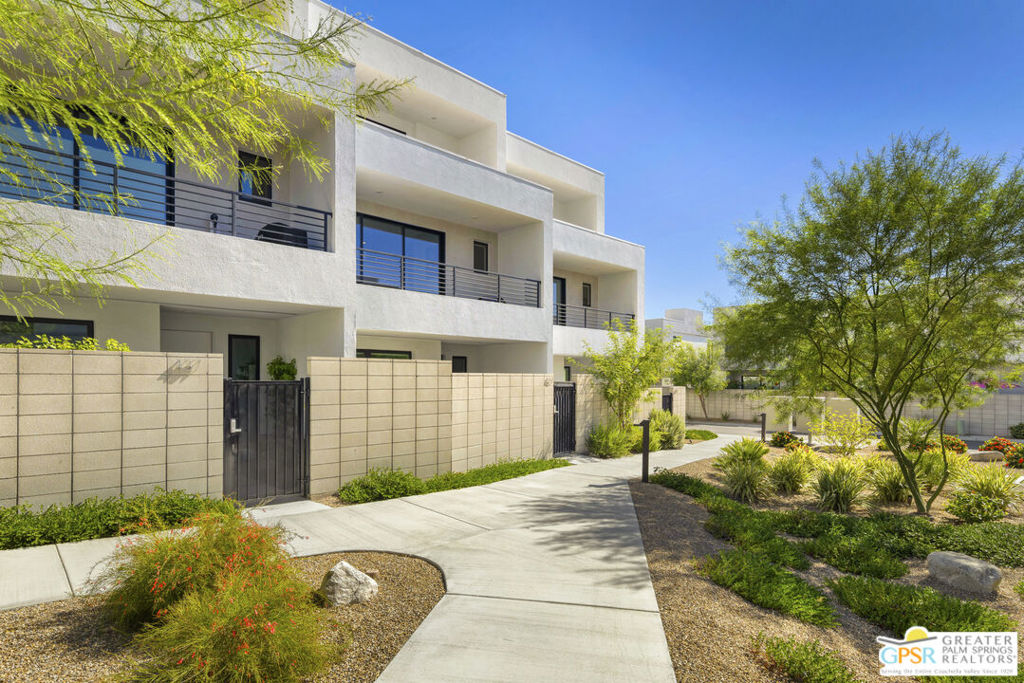 Experience stylish modern living in this stunning condominium at Cody Place, located in South Palm Springs in close proximity to downtown, shopping, and restaurants. Ideally sited north and south for the best desert living experience, the condo has wonderful separation which features a first floor guest bedroom with ensuite bath, a south facing private courtyard and a 2 car garage. The main living area is located on the 2nd floor and is completely open from front to back with stacking sliding doors, decks on both sides and offers inspiring views to the south and west including stunning vistas of Indian Canyons, the San Jacinto mountains and the Santa Rosa mountains. The dining area and great room flank the central kitchen featuring a massive 12 foot island, exquisite quartz countertops, sleek white acrylic cabinetry, and a custom tile backsplash. A powder room completes this level. The entire 3rd floor comprises the primary suite with a good sized primary bedroom and north facing balcony. The spa-like bathroom has dual vanities, quartz counters, oversized shower and a generous walk-in closet with "ELFA Decor" closet organization system. The flex/loft area can be used as a retreat, home office or media room with spectacular south facing views. Additional amenities include Hague water softening system, owned 14-panel solar under NEM-2.0 for cost savings and an EV Level 2 charger hard wired in the garage. Cody Place is a gated community and offers a modern clubhouse for gatherings, an outdoor kitchen with a BBQ area, a 50 foot lap pool and large "splash" pool. For those of you with a furry friend or two, there is a community dog park. Live the dream in South Palm Springs iconic Cody Place!