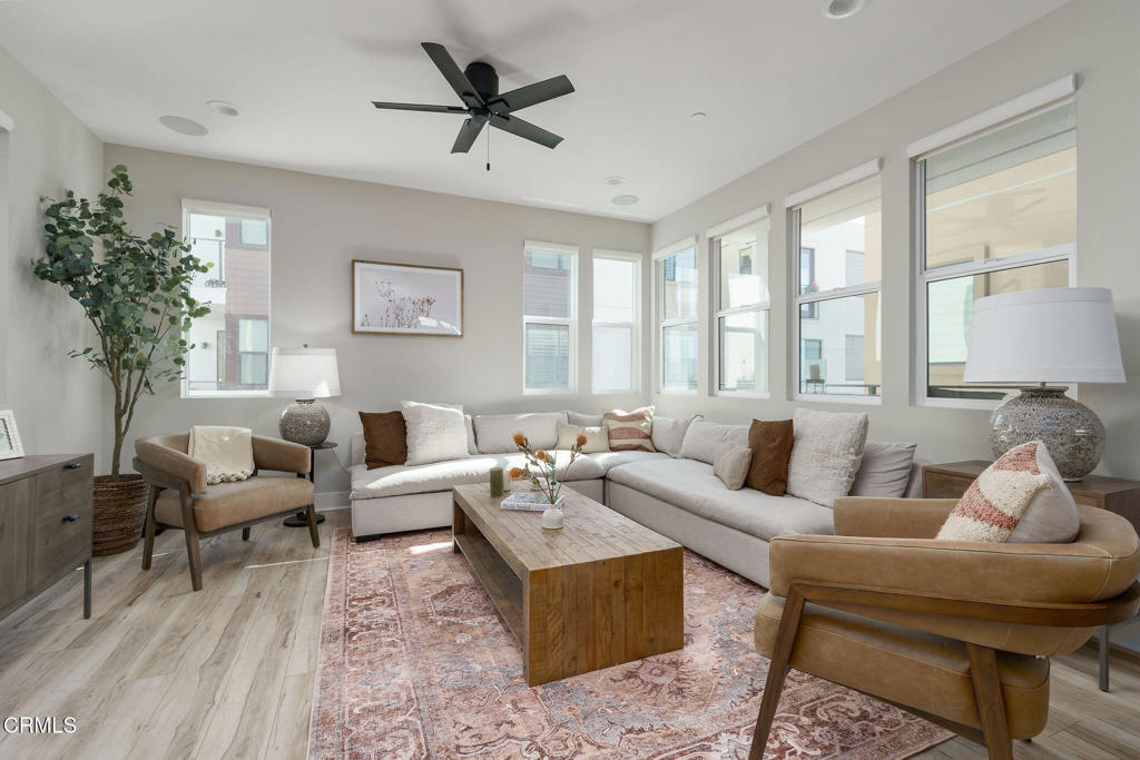 Step into contemporary coastal living with this fully furnished, professionally styled home, showcasing premium upgrades throughout. Flooded with natural light, the home features motorized window shades, recessed lighting, air conditioning, and rich wood flooring in every room.The backyard invites you to unwind with a built-in fire pit, low-maintenance turf, and a charming lounge area. Take in panoramic water views from the rooftop patio, main living space, and private balcony off the primary suite.Nestled in a desirable neighborhood offering resort-style amenities--including a pool, spa, and clubhouse--this home makes everyday life feel like a getaway. Just minutes from the beach, marina, dining, and shopping, with a scenic bike trail nearby.Includes a 2-car garage, with additional parking available throughout the community and on the street.
