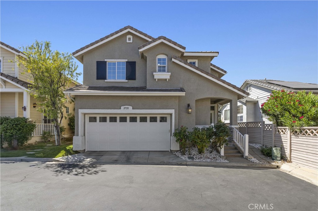Welcome to 27151 Manor Circle #54 an inviting 3-bedroom, 2.5-bathroom tucked away in the highly desirable Brighton Village neighborhood of Valencia Northbridge. This light-filled home features soaring ceilings, wood floors throughout the main level, recessed lighting, ceiling fans, and an open layout perfect for everyday living and entertaining. The kitchen offers stainless steel appliances, a center island, and plenty of counter space, while the adjacent living area showcases a cozy fireplace and direct access to a private backyard ideal for outdoor dining and relaxing. The spacious primary suite boasts a walk-in closet and en suite bath, and upstairs you'll find convenient indoor laundry. Additional highlights include a 2-car attached garage, guest powder room on the main floor, and a prime location at the end of a cul-de-sac, just steps from guest parking. Residents enjoy the Brighton Village community pool, spa, and barbecue area, along with all the perks of Valencia living. Youre surrounded by scenic paseo trails, beautiful parks, award-winning schools, and just minutes from shopping, dining, and easy freeway access. No Mello Roos!