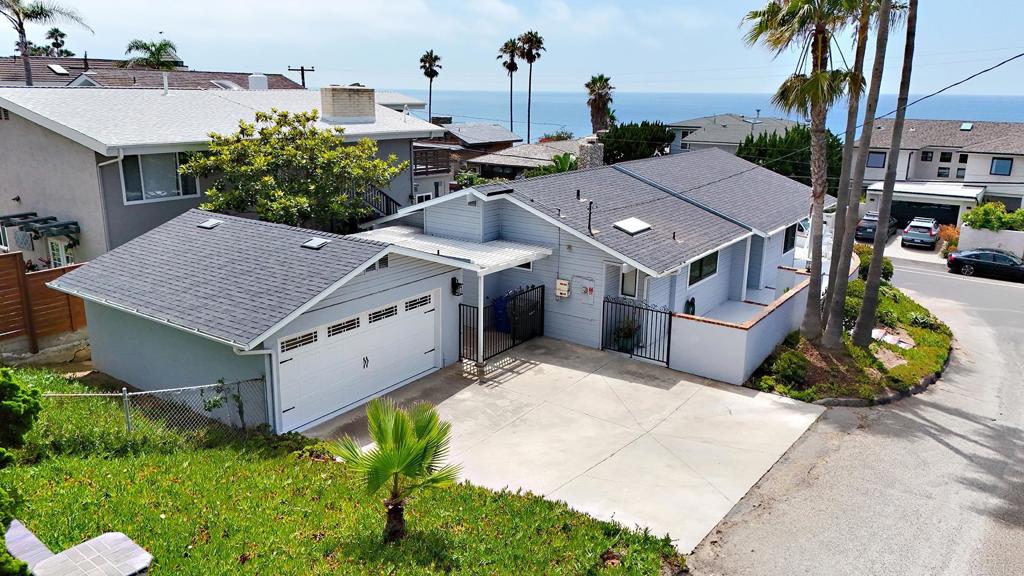Gorgeous 3 bedroom, 2.5 bath, 1540 sf with a large 2-car garage, fully solar powered! Welcome to your dream beach retreat in the heart of Encinitas! Available early November! Nestled on the pristine shores of the Pacific Ocean, this exceptional beach home offers an unparalleled coastal living experience. Wonderful, detached home on a corner lot - just steps to the Pacific Ocean and the white sand Grandview Beach, a well-known surf break! Lovely views of the ocean and gorgeous sunsets. Walking distance to Moonlight Beach, restaurants, entertainment and shopping. Wake up to the gentle ocean breezes, central air conditioning as well. The private deck off the living room invites you to soak up the sun, host memorable gatherings, or simply unwind with a good book. Relaxing outdoor living with a gated wrap-around porch and life-guard chairs for enhanced views! Fresh ocean air!! Enjoy a 3-hole putting green and exterior shower. Located in the desirable Encinitas community, you'll have easy access to charming local shops, trendy restaurants, and vibrant nightlife. Embrace the laid-back coastal lifestyle as you explore the nearby surf spots, hiking trails, and renowned attractions. Don't miss this rare opportunity to make 1577 Neptune Ave your home and experience the epitome of beach living! Lots of private parking with 4 spots on the driveway as well. Refrigerator, washer and dryer included. Will consider a pet with a good application!