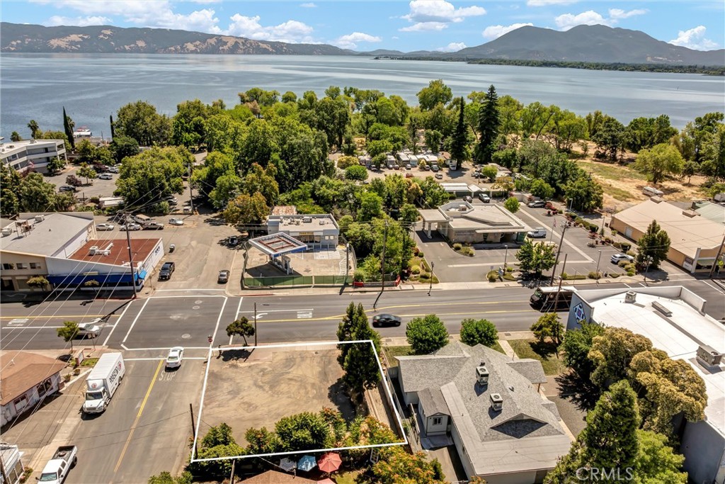 Great downtown Lakeport location! Nice level lot on the corner of Main Street & Armstrong. Public water/sewer and power close by (not currently hooked up but available). Would make a great spot for additional parking or small business set up. Only a block up from the Lake!