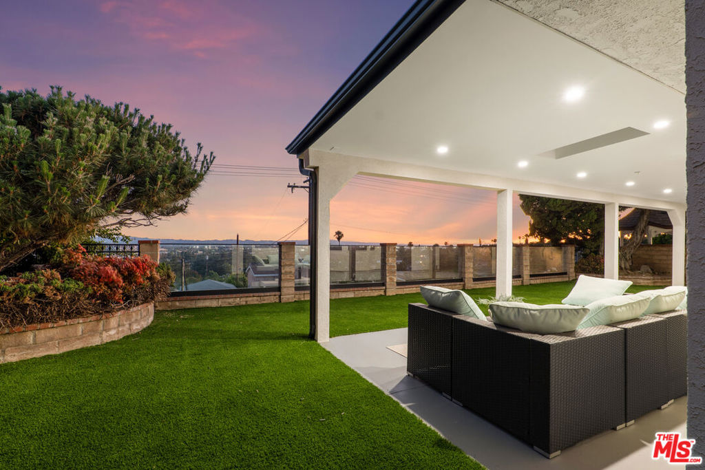 Experience elevated living in this beautifully remodeled 4-bedroom, 3-bathroom home, perfectly situated on a quiet cul-de-sac with stunning views. Thoughtfully redesigned with exceptional attention to detail, this residence blends modern elegance with timeless comfort. Every inch of the home has been updated with high-end, designer-selected finishes and materials, creating a sophisticated yet inviting atmosphere. The open-concept floor plan features spacious living and dining areas, ideal for both entertaining and everyday living. Large windows and sliding glass doors illuminate the home with natural light and frame the expansive views. The gourmet kitchen boasts premium appliances, custom cabinetry, and sleek countertops. The primary suite offers a serene retreat, complete with a luxurious en-suite bathroom and walk-in closet. Three additional bedrooms provide flexibility for family, guests, or a home office. Enjoy serene outdoor living with breathtaking hillside views stretching across Burbank, the San Fernando Valley, and Downtown Los Angeles. This turn-key residence offers the ideal combination of privacy, modern luxury, and convenience in one of Burbank Hills' most sought-after neighborhoods.