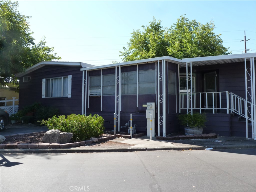 LIVING LARGE! This triple-wide, manufactured home has 1680 SF plus two Enclosed Porches, which provides over 1900 SF of living area. There are Two bedrooms, each one having an adjoining bathroom, and lots of closet space. The home is located in Cottonwood Estates, a Senior Park, for those 55 and older. The park is in downtown Oroville, close to medical facilities, stores, restaurants, a pharmacy, and convenient public transportation. Features include a newer roof and HVAC system, and new carpet. The Kitchen has an electric cook top, wall oven, a microwave oven, a new sink and new dishwasher, a pantry, and a breakfast bar. Additionally there is a formal dining area with china hutch off the living room. As a triple-wide home, the great room off the kitchen is extra wide and there is a walk-in closet in the primary suite. The Primary bath has direct access to the covered rear porch. The ramp in the front of the home can be accessed directly from the primary bedroom. One of the two enclosed porches has been used as an exercise room. The other porch is off the laundry room and opens to a fenced and tree-shaded back yard. The rear yard has gates at each end and two storage sheds. There are two parking places in front and the home is close to the park swimming pool and clubhouse. Park approval required for all adults intending to occupy the home.