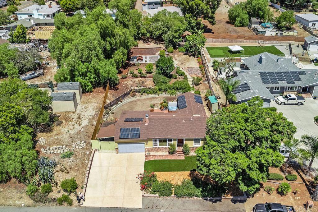 Opportunities like this don’t come around often. Located in a highly desirable neighborhood where homes are rarely available, this thoughtfully updated three-bedroom, two-bath home seamlessly blends classic charm with modern upgrades and versatile living. With approximately 1,450 square feet of interior space, plus a flexible bonus room that can be transformed to suit your needs, this home adapts to your lifestyle, whether you’re working remotely or hosting loved ones. Set on a spacious, approximately 0.35-acre lot, there's room to grow, entertain, and even build, from creating a lush garden oasis to adding an ADU for guest living or rental income. Between 2018 and 2025, the current owner invested in thoughtful enhancements that elevate both functionality and curb appeal, including: Seller-owned solar panels, Tesla backup batteries, a new retaining wall, extended carport, driveway, updated fencing, and more. This home offers energy efficiency and everyday convenience all in a welcoming space filled with natural light and character. Nearby Rancho San Diego shopping adds convenience to your everyday life as you enjoy your approximately 0.35-acre estate. Whether you're starting fresh, upsizing, or planning for the future, this property delivers flexibility, comfort, and value in one rare package.