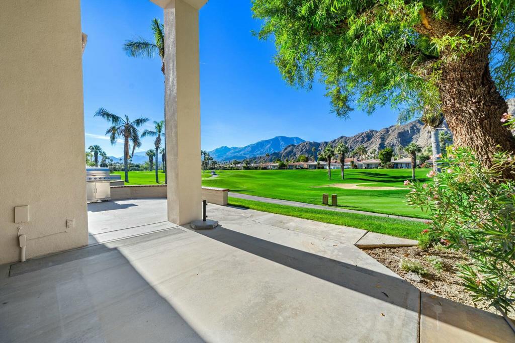 Available UNFURNISHED ON A LONG TERM BASIS. Enjoy PGA's vast accommodations and elite golf tournaments Introducing a three-bedroom, three-bathroom condominium spanning 1918 square feet, conveniently situated on a SINGLE level. Behold the captivating westward vistas of the Santa Rosa mountains, overlooking the scenic par 3 third hole of the renowned Arnold Palmer Private course at PGA West. Step into the inviting living room, adorned with a cozy fireplace and a convenient wet bar. The space seamlessly extends to a serene rear patio boasting a misting system and panoramic views that are nothing short of spectacular. The primary suite is a retreat in itself, offering three closets and a private patio complete with a romantic hot tub. The guest bedroom offers its own en-suite bath, while the third bedroom provides flexibility as a den or family room. A spacious 2-car garage ensures convenience, and just across the street awaits the community pool and spa, promising relaxation and leisure. Embark on a journey to explore the unique charm of this property and delve into the enticing advantages offered by the various levels of PGA West club membership. Don't miss the opportunity to make this exceptional condominium your new home.