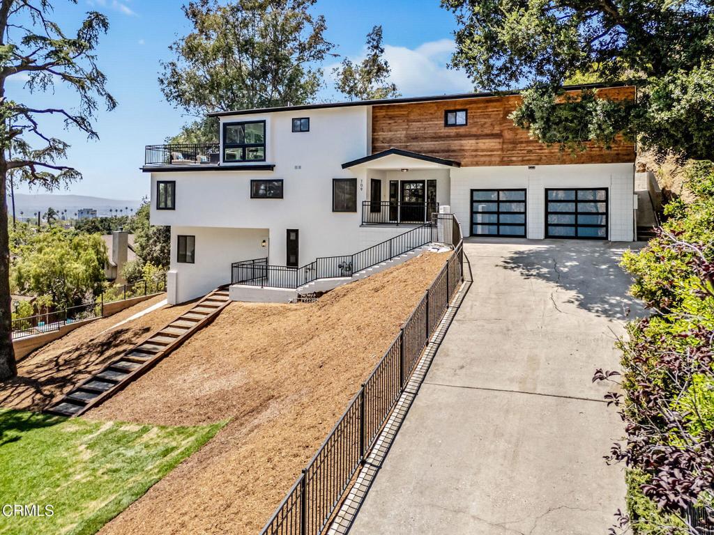 Welcome to 709 Wilson Ct -- a beautifully remodeled home perched on a spacious lot with sweeping views of Burbank. This stylish residence offers the perfect blend of comfort, functionality, and modern design in one of the city's most sought-after neighborhoods.Step inside to discover a bright, open layout featuring a completely updated interior, including new finishes, flooring, and fixtures throughout. The primary suite is a true retreat, complete with a walk-in closet, private balcony, and a sunroom that captures natural light and city views. The expansive backyard offers endless potential for entertaining, gardening, or future expansion.Tucked away on a quiet cul-de-sac yet just minutes from Burbank's vibrant shops, dining, and studios, this home is a rare opportunity to enjoy modern living with space, privacy, and unbeatable views.