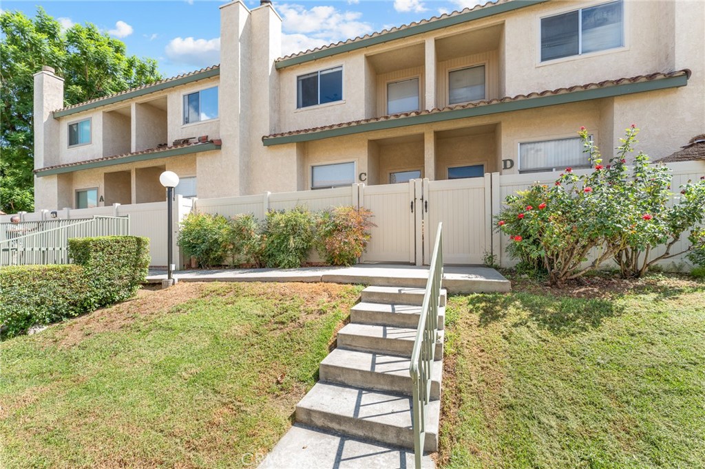 Step into modern comfort with this stylish 2-bedroom, 2.5-bath condo offering just over 1,500 sq ft of thoughtfully designed living space. The home has been refreshed with newer flooring, paint, and upgraded appliances, giving it a clean and contemporary feel from the moment you walk in. The main level features a welcoming living room with a cozy fireplace, a spacious dining area, and a versatile loft-style space overlooking the living room—perfect for a home office or study. Upstairs, both bedrooms are generously sized, including a private primary suite with its own attached bath. Enjoy the convenience of a 2-car attached garage with laundry, plus a private patio area right outside your front door—ideal for a small garden or relaxing outdoor space. The community is beautifully maintained with mature landscaping and offers a pool and spa just steps away. Located in highly desirable South Redlands, this condo puts you within walking distance of schools, restaurants, public transit, and just blocks from ESRI.