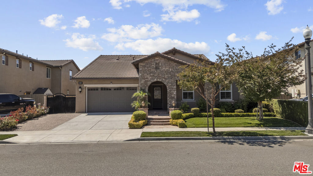 Welcome home to this exceptionally well maintained home in the desirable Village at the Park neighborhood in Camarillo. Featuring 4 bedrooms and 4 baths, which the Primary Master suite is conveniently located on the first floor as well as two other good size bedrooms with the 4th other bedroom and spacious loft on the second floor. The thoughtful open concept design with high ceilings which make it convenient for everyday living and entertaining. The custom accent walls and tons of storage and custom cabinets make it easy and convenient. Recessed lithing throughout the home and plantation shutters which allow for privacy and natural lighting when needed. The stainless steel aplliances are all included, as well as the washer and dryer. Custom front door, water softner system in garage, extended built in island, Rain gutters, tankless water heater and much more... The community features resort style ammenities including clubhouse, pool, spa, and playgrounds