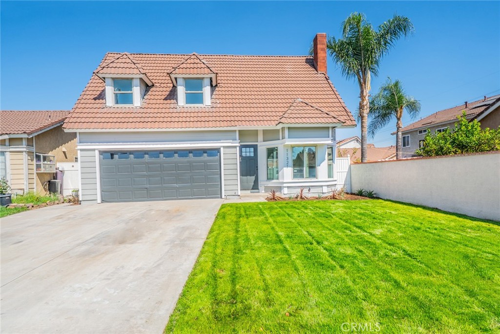 Welcome to this beautifully renovated 4 bedroom 2.5 bathroom home in the highly sought-after Southridge Community of Fontana. From the moment you step inside, you’ll be captivated by the soaring ceilings and cozy fireplace that create an inviting atmosphere in the living room, seamlessly flowing into the dining area—perfect for entertaining or family gatherings. The modernized kitchen is a true highlight, featuring white shaker soft-close cabinetry, updated appliances, and a spacious dining nook with views of the lush, private backyard. Fresh paint and brand-new flooring throughout the home elevate its appeal, offering a bright, clean, and sophisticated aesthetic. Convenience abounds with a downstairs half-bathroom and a dedicated laundry area, making daily living effortless. Upstairs, the primary suite impresses with expansive windows that fill the space with natural light, along with an attached bathroom for comfort and privacy. Three additional bedrooms and a full bathroom upstairs provide plenty of space for family or guests, each room offering beautiful views of the community and backyard. Outside, the spacious backyard features a lush green lawn and a charming patio area—an ideal canvas to create your dream outdoor retreat. The two-car garage and large driveway offer ample parking and storage options. This stunning Southridge residence combines modern updates with timeless comfort, all at an incredible value. Don’t miss your opportunity to make this beautifully renovated home your own!