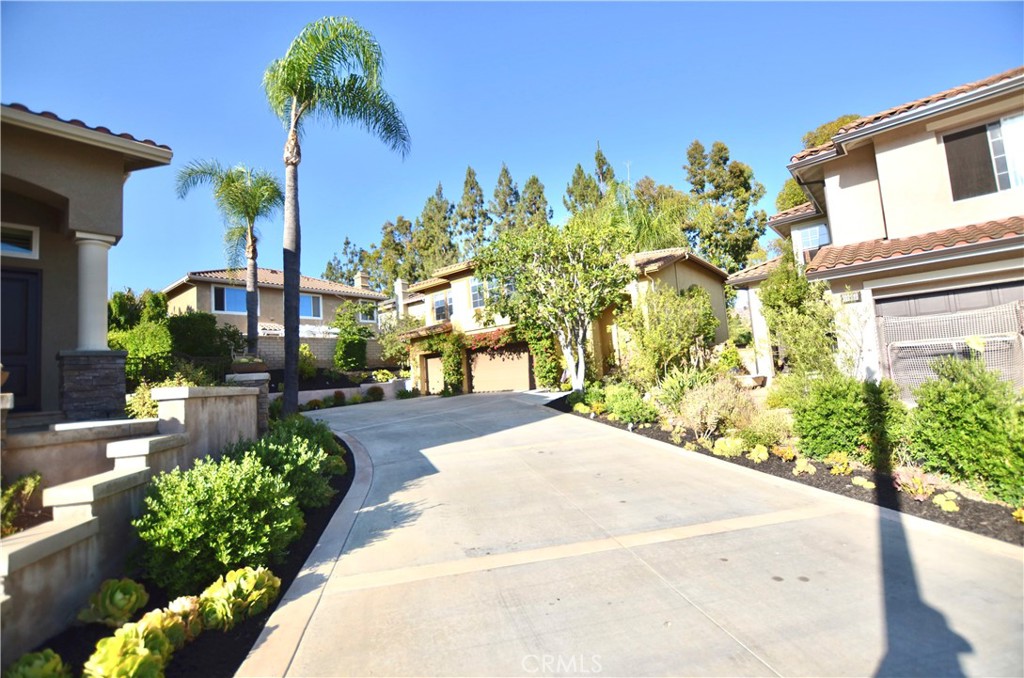 Welcome to a highly upgraded home in a unique location within the gates of El Dorado Community. Attention to details and contemporary design make this home special. Newer Kitchen, Quarts Counter tops with an Island, Stainless steel Appliances, new lightings under the cabinets and most importantly New Wood Look Porcelain tiles on the entire first floor and New Wood Flooring on the 2nd floor. Good size family room open to kitchen with a modern fireplace. Main floor Bedroom along with a full size renovated bath on the first floor. 3 large size bedrooms and a large bonus room on the 2nd floor. Contemporary Design in Primary Bedroom's shower, flooring and Free Standing Tub. All showers are renovated with quality quarts, tiles, cabinets and fixtures. Primary Bedroom enjoys a retreat with contemporary fireplace and a large walk in closet. 3 Car Garage and Epoxy flooring along with a very long driveway that can easily fit more than 6 cars. Walk to award winning schools, Association pool/BBQ/Green built and the best walking trails nearby including Peters Canyon behind the 2nd gate.
