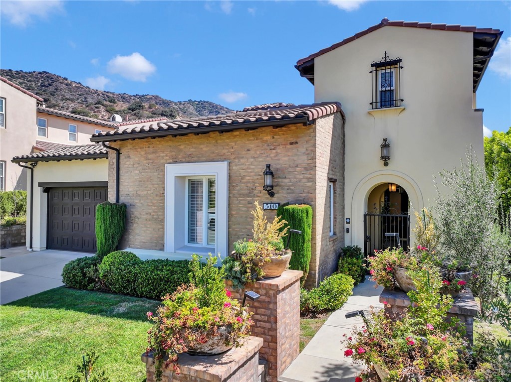 Welcome to 510 Viewcrest at the Rosedale Community designed by the award winning Taylor Woodrow homes. This Spanish style luxury home was built in 2007 nested over a large beautiful lot surrounded by the magnificent San Gabriel Mountain and city lights view, offering desirable privacy and prestige nature surroundings. The spacious home features a central courtyard and a covered area perfect for relaxing with family and friends. Adjacent to the courtyard, a private, detached casita with its own bath is perfect for guests stay-over or in-laws quarter. Through the front door you will enjoy an open floor plan creates a bright and airy atmosphere completed with built-in surround sounds and a formal living area with large panel windows creating abundance of natural lights filling the entire living space. The gourmet kitchen with a large granite island, stainless appliances, and a spacious formal dining is ideal for family gathering and celebration. The second floor includes total 3 suites, a large master suite with expansive balconies, separate vanities, a soaking tub, and multiple walk-in closets with upgraded shelves spaces. Also there are bonus spaces like a home office and an open room that can be used as an entertainment space. Outdoor area features BBQ area and stunning views of the mountains and city. Rosedale community offers parks, walk trails, gated recreational facilities with pool & fitness center. Must experience this wonderful home to appreciate.