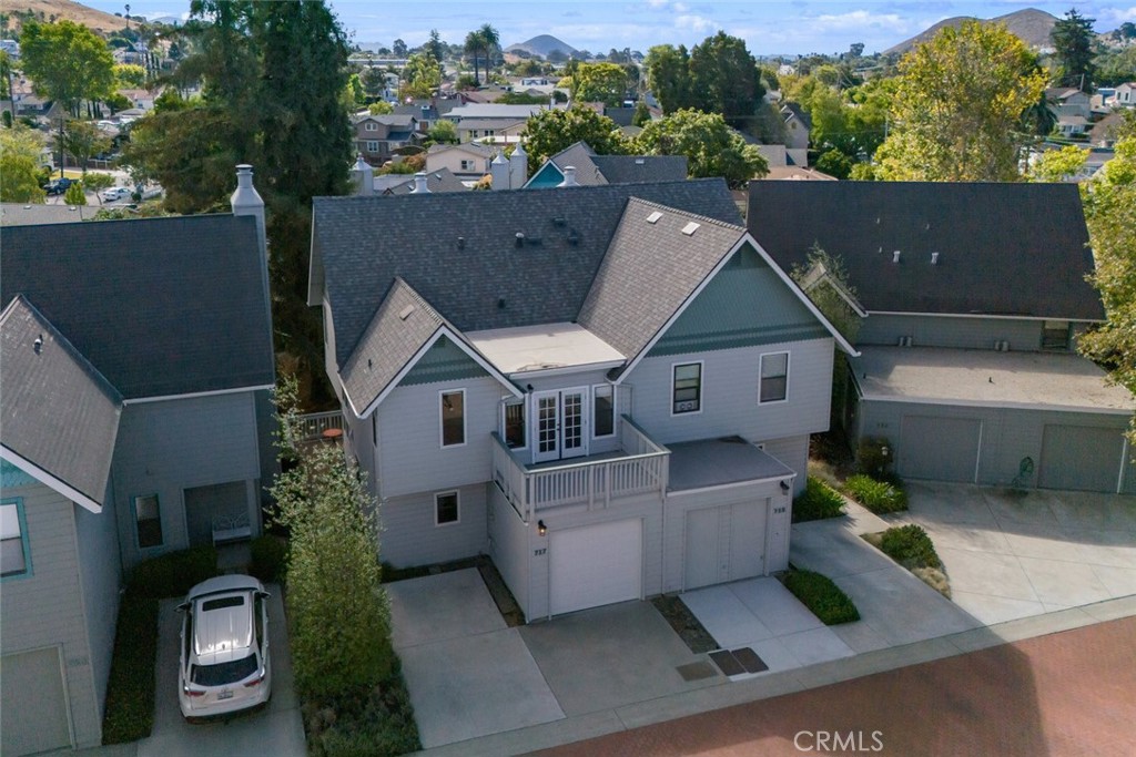 Welcome to your dream home in the heart of San Luis Obispo! Completely remodeled 3 Bedroom 2-½ Bath townhouse in the Historic District of vibrant downtown SLO offers convenience, lifestyle and little maintenance and just a short distance from CAL Poly. New exterior paint & roof to complete this turnkey gem. This meticulously remodeled home includes many custom furnishings specifically chosen and color-matched to enhance the peaceful Creekside location. Wall-to-wall wood floors throughout exude warmth & elegance. Soft light from southern exposure and a gas fireplace housed in an artful sculptural mantle in the living room create an inviting space for relaxation or entertainment. Freshly painted interior sets the stage for your personal touches. The custom kitchen boasts every amenity for the culinary enthusiast: top-of-the-line appliances, wide counters, abundant storage, pantry, pullout shelves & lazy Susan. A hint of sparkle in stone composite counters creates a masterpiece of efficiency & beauty. Whether hosting a dinner or preparing a casual meal, everything you need is at your fingertips. A flood of natural light makes the kitchen a pleasure. The bathrooms have modern fixtures, stylish tile & recessed lights. Main bedroom is furnished with a king size bed lit from beneath, ensuite bathroom with double sink vanity, large walk in shower, lots of closet space & heated tile floors invite you to unwind & refresh (laundry conveniently located upstairs). Beyond the stunning interior, 2 decks for Al fresco dining and garden boxes provide outdoor space. Garage with second adjacent parking space provides off-street parking with only a short walk to all the energy of Downtown SLO while living in the center of a block with 24/7 privacy & quiet. This is an incredible opportunity to own a remodeled, luxury home with a carefully designed interior, furnished & crafted with excellence and so much more. Contact us to schedule a viewing and make this fantastic property your new forever home!