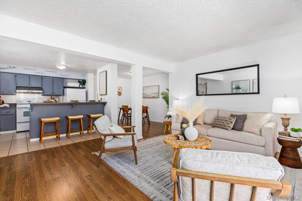 Largest 1-Bedroom Unit in the Point Loma Tennis Club – Versatile Floor Plan & Resort-Style Amenities! This rare ground-level condo offers the largest 1-bedroom layout in the complex, with an open and flexible design to suit your lifestyle. While located on the first floor, it’s set slightly above the walking path for added privacy. Freshly painted and featuring brand-new luxury vinyl plank (LVP) flooring, this home is move-in ready. The spacious living area opens to a long private patio, perfect for relaxing or entertaining. A versatile flex space offers endless possibilities—use it as a dining room, office, nursery, or even a guest room. The bedroom features two closets, while the unit also comes with two large storage lockers conveniently located in the garage near the assigned parking space. Recent updates include upgraded electrical for peace of mind. Enjoy the unmatched amenities of the Point Loma Tennis Club, featuring expansive green spaces for picnics or walking pets, a large pool, hot tub, men’s and women’s saunas, BBQ grills, fire pits, a gym, clubhouse for hosting events, and tennis courts. The HOA covers water, trash, and recycling, making for easy, low-maintenance living. Don’t miss your chance to own this spacious, well-appointed home in a highly sought-after community!