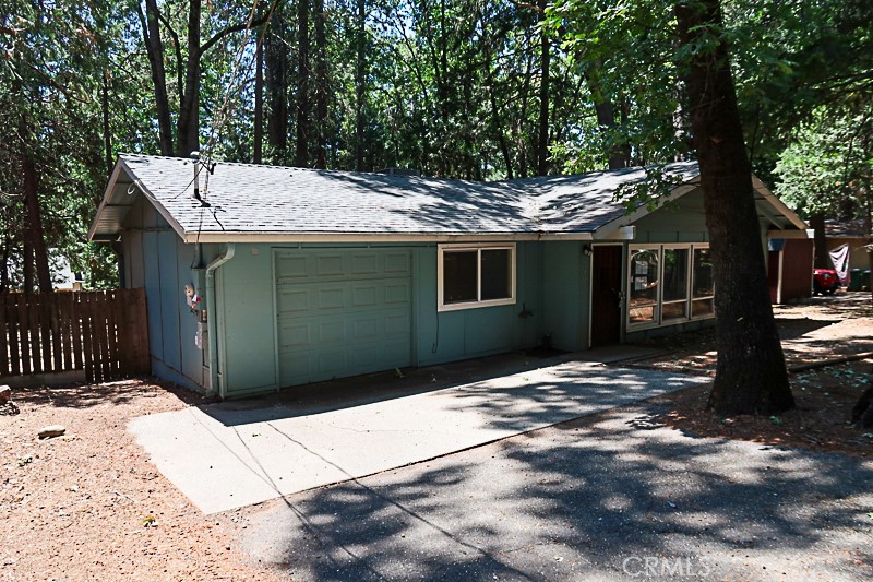 Charming HUD Home in the Pines! Nestled in the peaceful foothills of Magalia, this lovely 3-bedroom, 2-bath home offers the perfect blend of rustic charm and modern comfort. Featuring vaulted wood ceilings and a cozy woodstove, the living space exudes a warm, cabin-like feel. The functional layout includes a spacious living area, a walk-in shower in one bath, and a tub/shower combo in the other. Enjoy the convenience of a separate laundry area, an attached single-car garage, and a fully fenced backyard — ideal for pets, gardening, or relaxing under the pines. Step out onto the large back deck, perfect for entertaining or simply enjoying the crisp mountain air. This all-electric home is located in the affordable Paradise Pines HOA (only $315/year), which offers wonderful amenities including a clubhouse, pool, bar, and community activities — just down the street! Located close to abundant outdoor recreation including Lake Oroville, Paradise Lake, Lime Saddle Marina, and opportunities for fishing, boating, hiking, and hunting, this home is a great base for mountain living or weekend getaways. All information per appraiser or public records; buyers to verify.