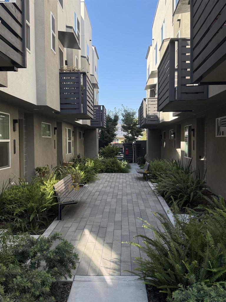 3957 Wattling St, a luxurious like-new townhome residence situated just blocks from the BART station & a few minutes away from the vibrant dining, shopping, parks on Alameda Island. It is a collection of 51 solar powered town homes. Offering a unique opportunity for both first-time homebuyers and investors. Standard features include a solar panel system, Nest thermostat, Quartz countertops, GE Profile stainless appliances, smart thermostats, solar systems, and energy-efficient appliances;2 car tandem garage and storage space. This spacious three-level townhome-style condo features 3-BR|3-BA, along w/ an expansive open great room, dining and kitchen combo; First bedroom with full bathroom on the main floor, master suite and 3rd bedroom(or an office)are upstairs; Very convenient location with I-880 to the entire Bay Area. Fresh interior wall paint; Like-New carpet and many more upgrades. HOA provides a private outdoor Bar-B-Q park.