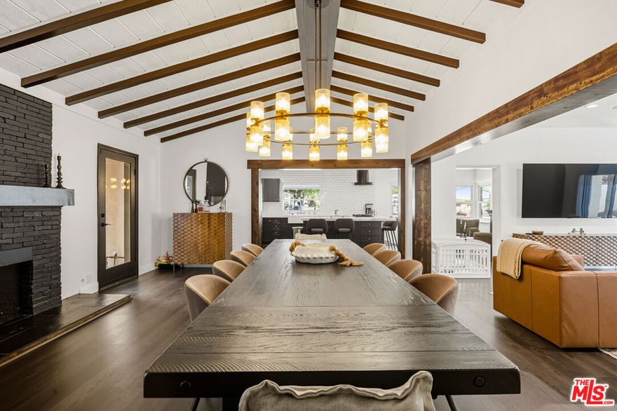 Introducing a timeless Montecito-style Spanish estate, tucked away on a private cul-de-sac in Northridge. Resting on a half-acre lot, this gated property offers 5 bedrooms, 4 bathrooms, and over 3,300 sq. ft. of thoughtfully designed living space, including a private guest house/ADU with its own kitchen, bedroom, and entrance.The main residence features a spacious open floor plan ideal for entertaining, with a light-filled living room, formal dining room with fireplace, and direct access to multiple patios. A recently updated chef's kitchen with its own fireplace, a separate laundry area, and 4 generously sized bedrooms provide both comfort and convenience.Resort-style living awaits outdoors with a heated pool and spa, lush gardens, and multiple seating areas for dining and entertaining. The circular driveway, detached garage, and manicured landscaping create a sense of privacy and sophistication.This is a rare opportunity to own a private retreat that combines timeless character with modern updates and resort-inspired amenities.