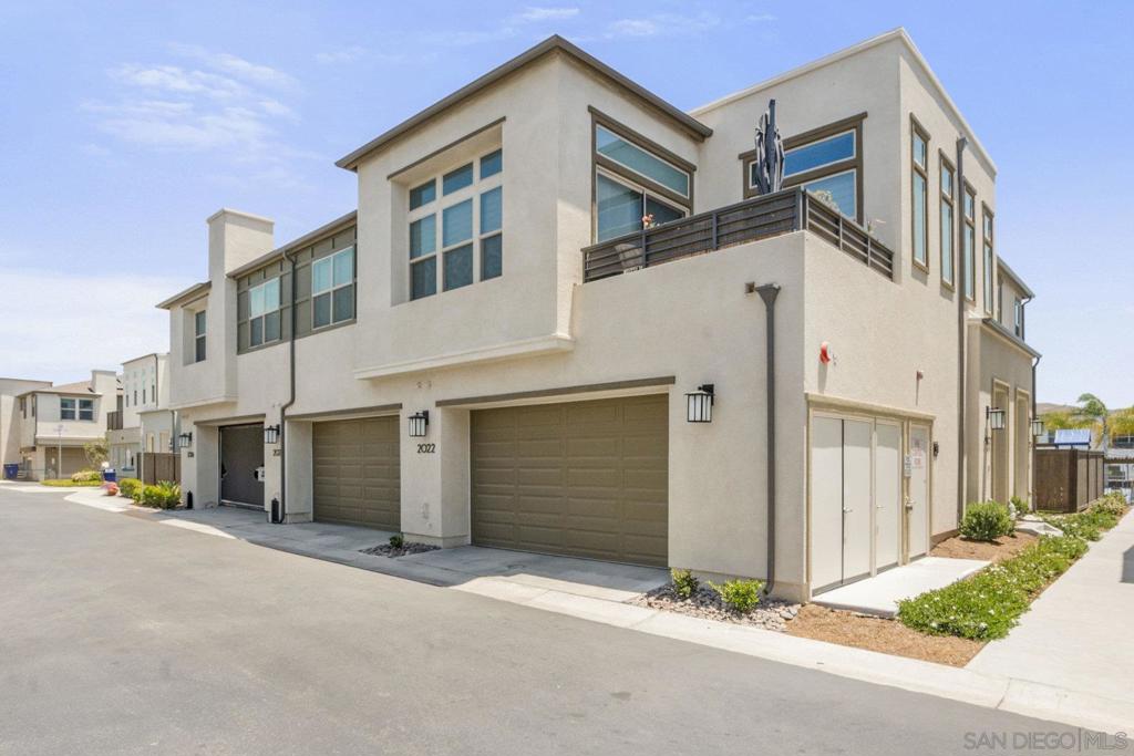 Do not miss this beautifully upgraded townhome located in the highly desirable Cota Vera community of Otay Ranch. Built in 2022, this immaculate home offers a rare combination of modern design, natural light, and privacy. The premium south-facing location above the community pool gives you ample natural light throughout the day and the privacy of no neighbors behind you. Upgrades include owned solar panels, stylish flooring throughout, designer window shades, and energy-efficient features. The spacious and thoughtfully designed layout features four bedrooms and three full baths, including a full bedroom and bathroom on the entry level—ideal for guests, a home office, or multi-generational living. The open-concept great room connects seamlessly to the chef’s kitchen, which is equipped with a large center island, quartz countertops, and sleek cabinetry. Perfect for entertaining or casual family dinners. Upstairs, you'll find three additional bedrooms, a laundry room, and a generous primary suite with a walk-in closet and spa-inspired bath. Outside, the backyard has been finished with premium turf, offering a low-maintenance space ideal for kids, pets, or simply relaxing in the San Diego sun. Cota Vera is a masterplan community in the rolling hills of Otay Ranch in Chula Vista. Residents enjoy access to a variety of amenities, including a resort-style pool with cabanas, playgrounds, a dog park, an art walk, an amphitheater, and community events. Top-rated schools, nearby parks, shopping, and dining are just minutes away, and downtown San Diego is only about 10 miles away. If you’ve been looking for a move-in-ready home in one of Chula Vista’s most exciting new communities, this one is not to be missed!
