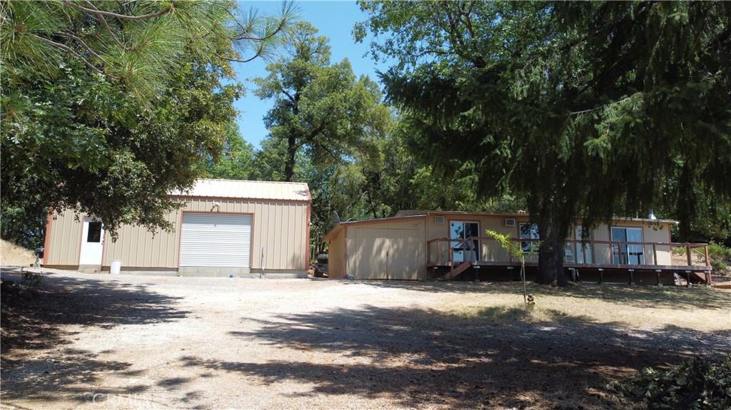 MOUNTAIN RANCH 19 acres with two street frontages and bordering Boggs Lake Reserve. Small home and large metal shop with additional recent bathroom and kitchen, in addition to the garage. Formerly a licensed cannabis farm of around 24,000 sf of canopy with fenced gardens and water facilities fully intact. Excellent well. Fruit tree orchard. Total privacy and seclusion. Room for another main home, allowing the existing to be a secondary unit. Impressive mature madrone trees. Stunning rock features. This property is exceptionally well set up with great potential.