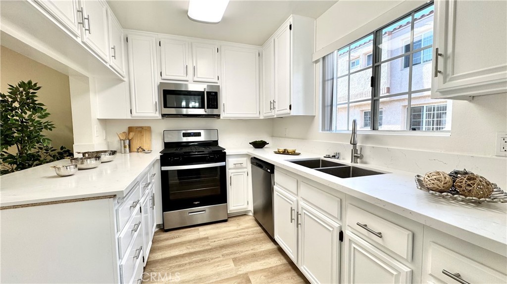 2-bedroom townhouse in a gated community, Windsong. New laminate flooring throughout with updated kitchen and bathrooms. Master bedroom has a walk-in closet and master bathroom comes with dual sinks. Nice size guest bathroom with full bathroom. The unit is located in a quiet area within the community. Community offers swimming pool and spa. Walking distance to Wilson Park and Madrona Marsh and short drive to the Del Amo shopping mall and beaches.