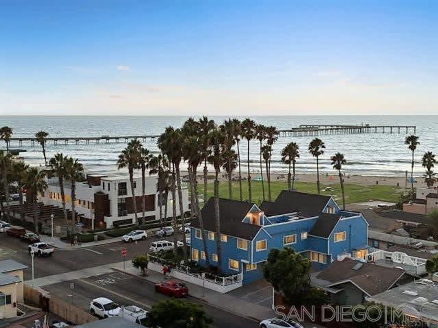 Ocean Beach Cottage with Views Just a half block from the sand and park, this charming 2BR/2BA single-level unit offers stunning ocean and pier views from the living room and front yard. Fire up the BBQ while waves crash and the sun sets over the pier. Only 2 blocks from shops, restaurants, bars, and the iconic OB Pier. Boogie boards, chairs, towels, umbrellas, and sand toys provided—everything you need for a perfect Cape Cod-style coastal getaway. This fully upgraded beach cottage features an open floor plan with fireplace, wall-mounted TV, and breakfast bar. The kitchen has stainless steel appliances, quartz countertops, and is stocked for home-cooked meals. The king bedroom has its own bath with tub, while the second bedroom offers a queen bed. A full-size pull-out sofa in the living room provides extra sleeping space. The home also has A/C, though ocean breezes and the sound of waves make opening the windows irresistible. The private front yard is ideal for morning coffee, afternoon BBQs, or simply relaxing with ocean views. The swim- and surf-friendly beach is just steps away, and the OB Pier—the longest concrete pier on the West Coast—is perfect for scenic walks, fishing, or dining. Tide pools below the pier are great for exploring. One of four units in the building, this cottage is perfect for couples, families, or groups needing multiple rentals. STR-11195L | TOT-617561