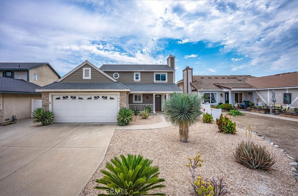 Stunning 3br 2.5 bath Terra Vista home with viewing deck and two fireplaces! This rare beauty has been meticulously upgraded throughout, from the newer roof and oversized AC system, to the dual pane windows and new luxury vinyl flooring and plush carpeting. From the first view, this property makes an impressive statement... crisp, clean and contemporary. The living and family rooms show light and bright and each boast an elegant marble clad fireplace. The spacious dining room is adjacent to the welcoming kitchen that is equally suited for the family and your inner gourmet, featuring granite counters, warm golden wood cabinetry, stainless steel appliances, recessed lighting, and an abundance of prep surface and storage space. The convenient half bath completes the first level. On the second level, there are three generously sized bedrooms and two full baths, including the Primary retreat with large mirrored closets and dual pane slider leading to nicely sized trex balcony with city light views. The private en-suite has a granite vanity and walk in shower. Easy care back yard with auto drip system is perfect for both entertaining under the covered patio, or quiet relaxation listening to the tranquil wall fountain. New vinyl fencing provides elegance and privacy, and the two car garage, indoor laundry, excellent Rancho schools, and convenient proximity to shops and dining, make this a perfect place to call home!