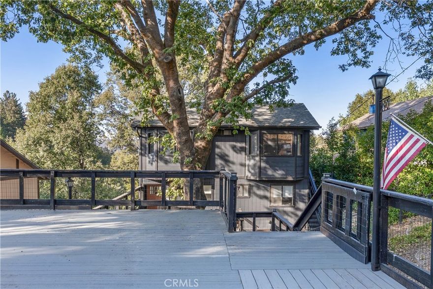 Tucked away in a peaceful community, this home offers the perfect blend of comfort, charm, and opportunity. With a 1-year-old roof, a gated flat yard, and breathtaking views, it is a rare find in the mountains.

Stepping inside you are greeted by vaulted ceilings, a stone fireplace, and thoughtfully chosen furnishings that stay with the home, creating a space that feels both warm and inviting. Picture mornings with coffee on the deck, evenings spent in the hot tub, and quiet nights by the fire. Multiple decks wrap around the home, offering the ideal setting to relax or entertain while surrounded by nature.

Yes, this home is being sold fully furnished, making it truly turnkey. The previous owners enjoyed great success as an Airbnb, and you have the same opportunity from day one, or you can keep it all to yourself as a private mountain getaway.

This is more than a home, it is a retreat ready for its next story.