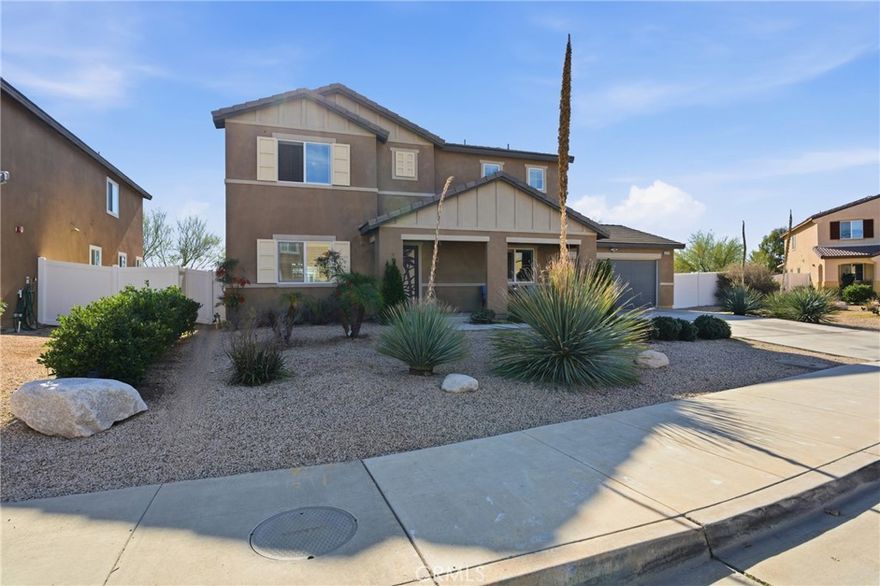 This move-in-ready 4-bedroom, 3-bath home is located in one of Moreno Valley’s most sought-after neighborhoods and sits on a large 0.25-acre lot. Designed for comfort and flexibility, the home features an open-concept layout with abundant natural light, wood flooring throughout, crown molding, and a highly desirable downstairs bedroom with a full bath.

The upgraded kitchen includes an oversized island, granite countertops, stainless steel appliances, tile backsplash, and a custom pantry door, seamlessly connecting to the living and dining areas—perfect for entertaining. Upstairs offers wood flooring and plantation shutters throughout. The low-maintenance backyard features a vinyl patio cover, ceiling fans, and rain gutters, making it ideal for year-round enjoyment. Convenient freeway access, nearby shopping, and close proximity to elementary, middle, and high schools complete this exceptional opportunity.