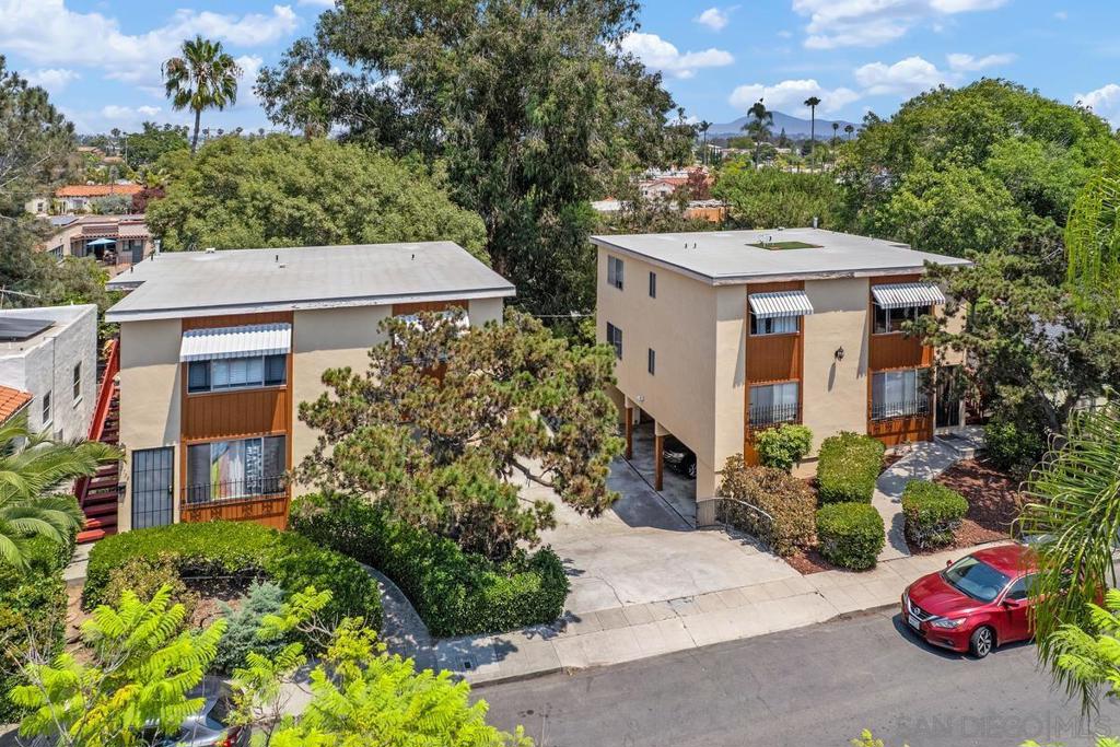 A rare, investment opportunity in prime North Park. Surrounded by single family homes in the charming, historic Altadena neighborhood, this multi unit property is truly a rare find. Situated on two separate parcels totaling 12,382 SF, the property features four individual 3 BD 2 BA units. Comprising of two 2 story buildings with a shared driveway, onsite covered parking stalls and laundry facilities. Each single level unit is a spacious 1,171 SF and a mirror image of each other. Features include a kitchen and open dining area, large living room, separate hall bath and primary bedroom with ensuite bathroom, plus 2 other bedrooms, ample storage closets and a private patio that overlooks the canyon behind the property. The property has been well maintained over the years and each unit has a very functional floor-plan with good flow. The property offers excellent, long term potential and is located in one of San Diego's most vibrant and walkable neighborhoods with strong rental demand and long term upside. Residents enjoy North Park's vibrant atmosphere with top rated restaurants, boutique breweries, nightlife, shops and easy access to Balboa Park and freeways.