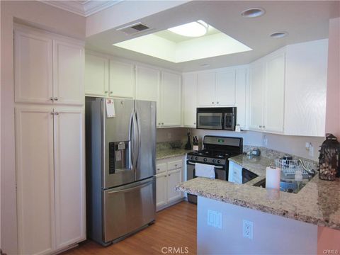 Photo of 19431 Rue De Valore #39E, Lake Forest, CA 92610 (MLS # CV26062144)