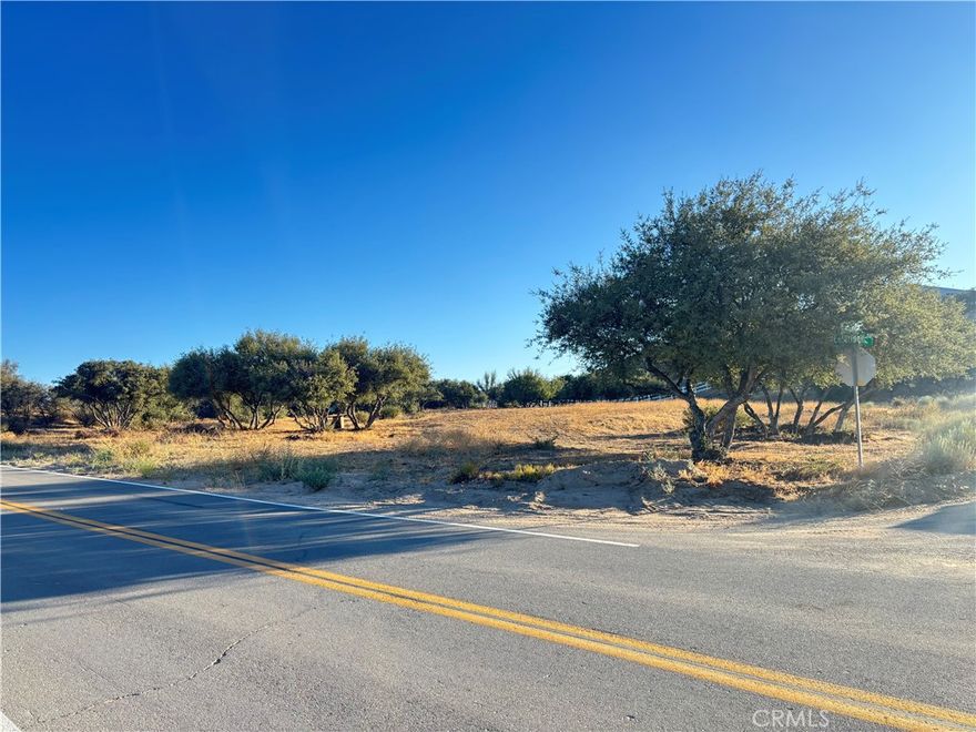 Don't miss this rare opportunity to own a 1.99-acre corner lot in the highly sought-after East Oak Hills community. Located on paved roads and surrounded by custom homes, this property offers plenty of space to build your dream home with room to spare for your RV, off-road toys, and more. Enjoy wide open skies, peaceful surroundings, and easy access to the 15 Freeway for a quick commute. Utilities nearby. Whether you're ready to build now or invest for the future, this lot offers the space and location you've been looking for! Seller may finance with substantial down payment.